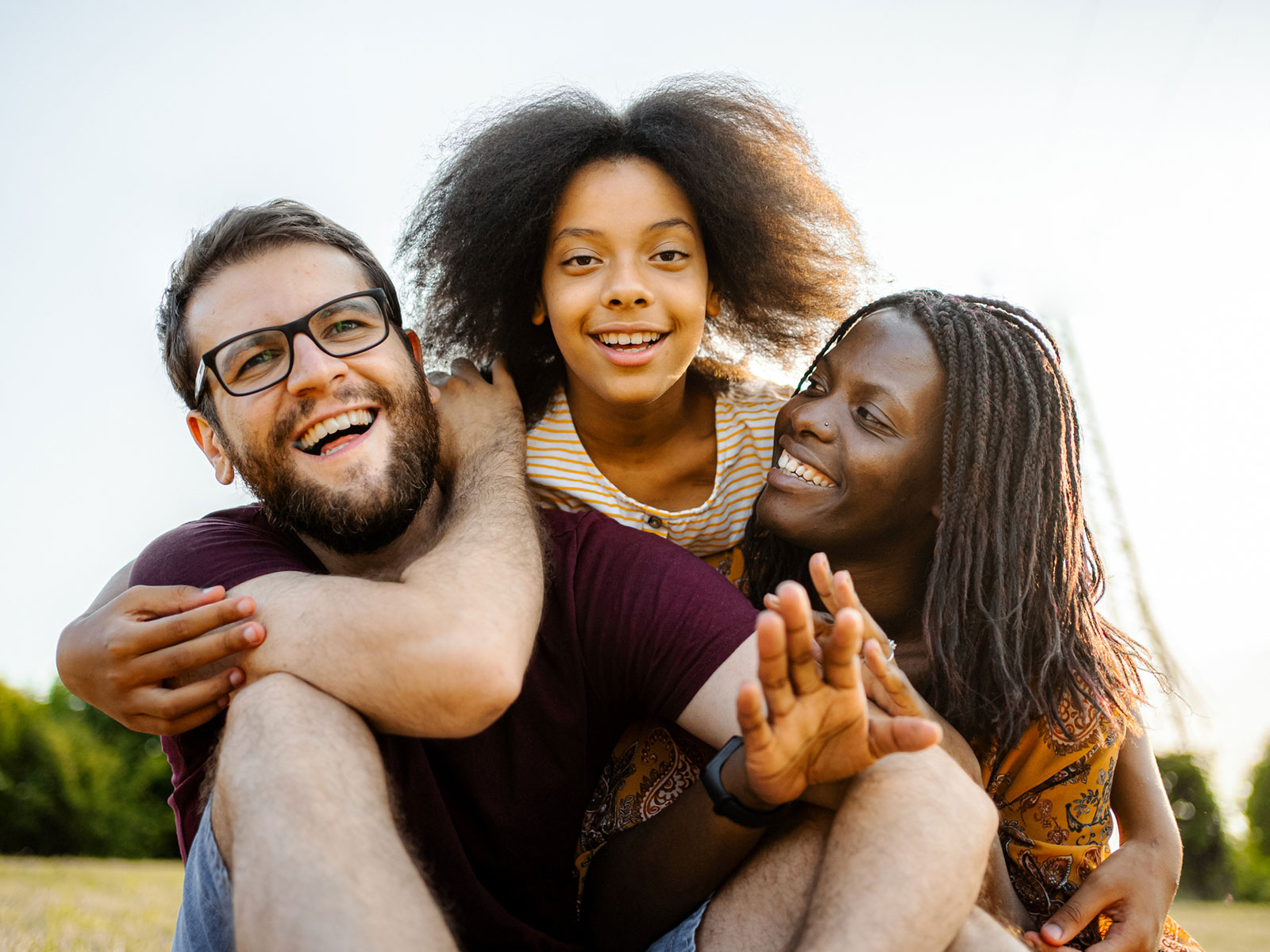Adoptive family takes a family photo.