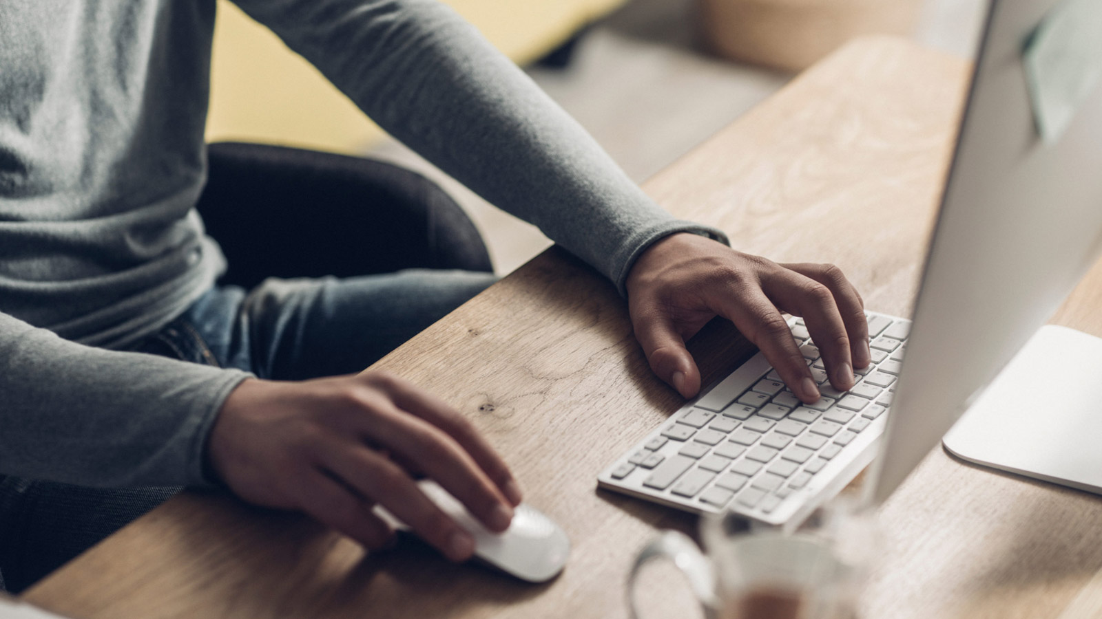 Man searches for information about foster care agencies on a computer.